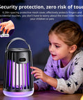 Rechargeable Solar Mosquito Zapper Lamp For Outdoor Use with protective mesh, purple light in sleek black housing near child.