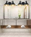 Two Light Vanity Wall Sconce In Oil Rubbed Black Finish illuminating bathroom mirror