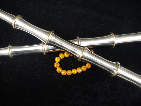 Close-up of Handmade Chinese Kung Fu Sword Pair With Stainless Steel Blade And Brass Fittings against a black background