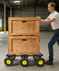 Totally Savage Six Wheel All Terrain Furniture Dolly With 1200 Pound Capacity Built Like A Tank For Heavy Duty Moving Rugged Carbon Steel Frame And Rock Solid Rubber Wheels For Easy Move On Carpet Tile Floors And Bumpy Concrete Ground. Man pushing stacked wooden crates on six-wheel dolly