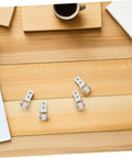 6 Pack Rock Solid Sliding Door Rollers With Galvanized Nylon Tracks For Cabinets And Furniture on a wooden surface.