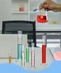 Six Piece Glass Graduated Cylinder Set With Rack 5Ml To 250Ml Clear Lab Tubes For Chemistry Projects on desk with red liquid beaker