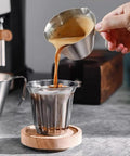 3.4 Oz Espresso Cup With Handle Premium Stainless Steel Cappuccino Accessories Double Spout Measuring Cup With Dual Scale Latte Shot Mug With V Shaped Mouth 100 Ml pouring coffee into glass