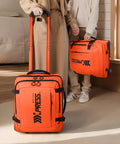 Underseat Carry On Luggage With Handle 17 Inch Travel Duffle Bag For Men And Women Orange Lightweight Durable Airplane Bag Big Capacity With Rugged Zippers For Your Go To Easy Travel, shown in a home setting.