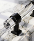 Close-up of 10 Pack 3.75 Inch Center To Center Cabinet Pulls Round Tube Acrylic Black Modern Drawer Handles showing clear tube design.