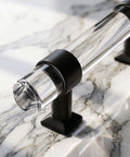 Close-up of a 5 Pack Cabinet Pulls For Kitchen And Bedroom 3.54 Inch Center-To-Center Black Zinc Alloy With Clear Acrylic Tubes.