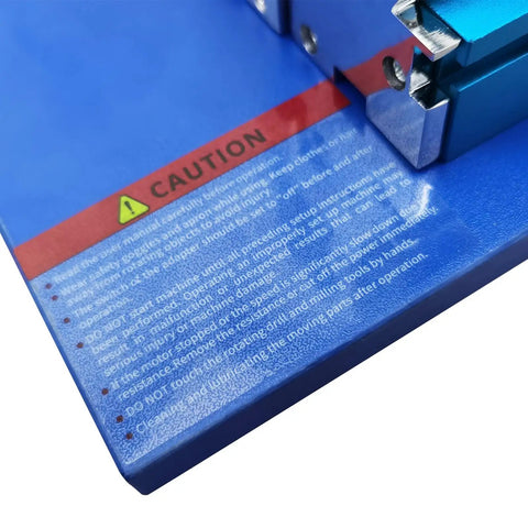 Caution label on blue surface of Garage Ready Mini Metal Milling Machine With Benchtop Lathe And Slick Precision Vise For 3000 Rpm.