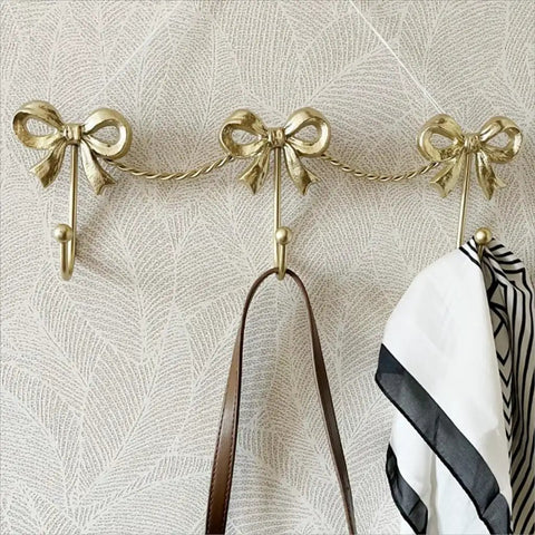 Kickass Heavy Duty Wall Mounted Coat Hook Bulletproof Metal Clothes Hanger with decorative bows, ideal for hanging bags and scarves.