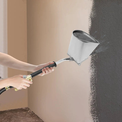 Heavy Duty Four Jet Pneumatic Cement Stucco Sprayer Gun With Upward Angle Nozzle applying texture to wall.