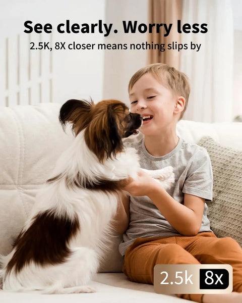 No Sweat Setup 4Mp Indoor Security Camera With Solid Hd Video And Clear Two Way Audio Free Ai Motion Tracking Night Vision Plus Easy Phone App Control For Your Pooch Around The Clock showing a boy playing with a dog.