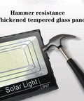 Hammer testing the hammer-resistant glass panel of Solar Light Outdoor Garden Flood Light 150W 200W 300W Led Super Bright.