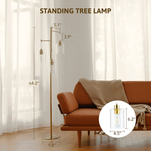 Dope Gold 64 Inch Tree Floor Lamp With Three Branches And Glass Shades next to a brown sofa in a living room setting.