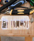Heavy Duty M6 Hex Socket Head Cap Screws And Barrel Nuts Set For Furniture Fixing And Do It Yourself Projects in box on workbench