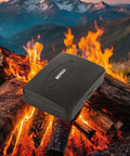Water And Fire Resistant Portable Security Case With Solid Steel Build against a mountain backdrop and flames