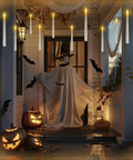 Floating Battery Operated Taper Candles Pack, 6.5-Inch LED Flickering Flameless Tapers hanging in a Halloween porch decor scene.