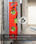 Rock Hard Professional Grade Cast Aluminum Torpedo Level With Magnetic Dual View Plumb Vial For Quick And Dirty Measuring And Tight Drywall Joint Layouts On Site showing rare-earth magnets on a wall.