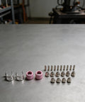Top 24-Piece Plasma Cutter Consumables Kit For SG-55 AG-60 WSD-60 includes nozzles, electrodes, and shields on a gray surface.