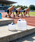 10L Collapsible Water Container With Spigot For Camping And Hiking, shown on track field near athletes, ultra portable design