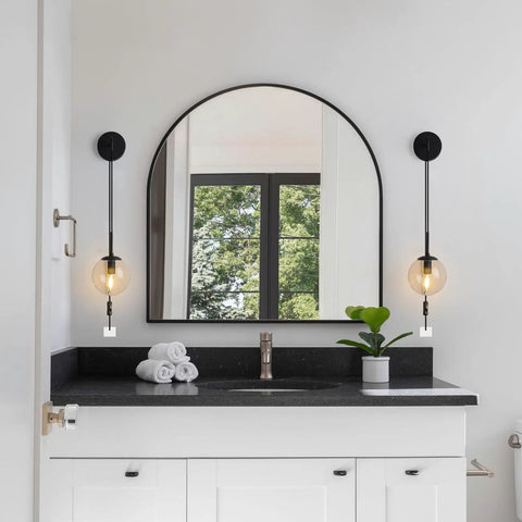 Set Of Two Black Plug In Wall Sconces With Globe Clear Glass Shade For Bedroom And Bedside centered above bathroom vanity