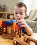 Child building with Oak Creek Lodge Wooden Building Set With 137 Real Maple Logs, Retro Construction Fun For Kids 3 Plus toy