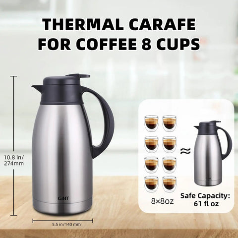 Stainless Steel Thermal Coffee Carafe With Double Wall Vacuum Insulation Keeps Your Brew Piping Hot Up To 12 Hours Or Cold Up To 24 Hours 65 Oz One Point Nine Liter Leak Proof Lid Silver displayed on wooden surface.