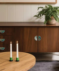 2 Pack Teal Beach Gold Fluid Cabinet Pulls, 3 Inch Hole Center on wooden dresser with candles and plant