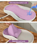 Person pouring liquid on purple liner demonstrating 4 Pack Waterproof Changing Pad Liners For Universal Fit With Extra Thick Ultra Soft