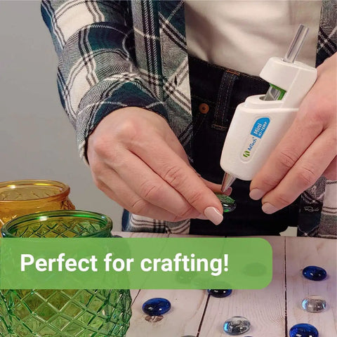 Person using a glue gun with High Temp Mini Hot Glue Sticks 4 Inch 200 Count Two Pack For Crafting DIY And Repairs With Strong Bond