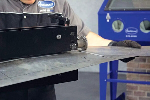 Elite Bead Roller With 27 Inch Throat Capacity forming metal panel, used for floor pans and firewalls with die set in garage setting.