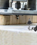 Router in use on wood, showcasing Top Shelf Four Piece Roundover And Bead Router Bit Set With One Quarter Inch Shank for smooth edges.