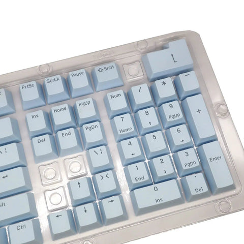 Premium PBT Keycaps With Dope Colorway And Ergonomic Arc Fit Smooth Typing Feel Hella Durable Oil Resistant Texture Perfect 108 Keys Layout For Gaming Rigs And Productivity Workstations In Light Blue Finish close-up view of light blue keyboard keys.