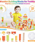 Front view of a toddler playing with a colorful 100-piece wooden building blocks set with storage lid.