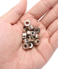 Hand holding 15 Piece Set Screw Shaft Collars 4.05mm Bore 9mm OD 5mm Width Nickel Plated Carbon Steel Drill Stop Collars