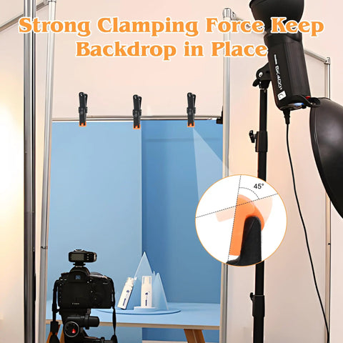 Heavy Duty 4.5 Inch Plastic Spring Clamps Set of 10 Backdrop Clips holding blue backdrop in photography studio setup