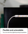 Smart LED Light Strip Bundle With 120 Inch Main Strip And Two 40 Inch Extensions shown on edge of black surface