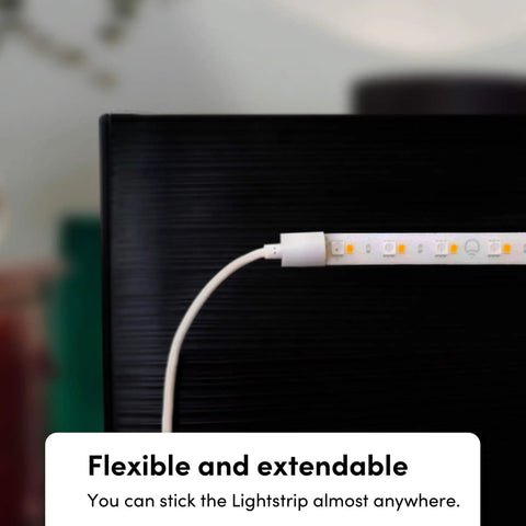 Smart LED Light Strip Bundle With 120 Inch Main Strip And Two 40 Inch Extensions shown on edge of black surface