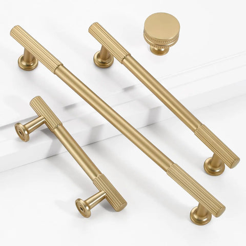 1.17 Inch Champagne Bronze Cabinet Knobs Set Of 2, Solid Zinc Alloy, Rust Resistant with matching handles on white surface