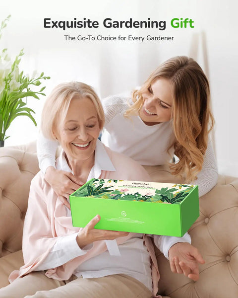 Two women with gardening gift box labeled exquisite gardening gift, seated on sofa with green plant in background.