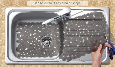 Pebble Sink Mat 2 Pack For Stainless Steel And Ceramic Sinks, PVC Dish Drying Mats Protectors being cut to fit sink shape.