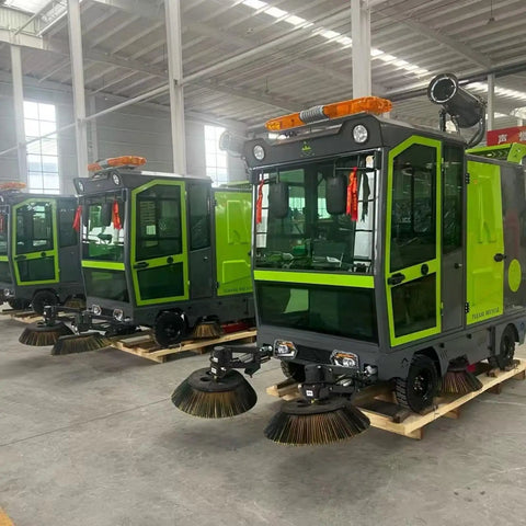 Heavy Duty Commercial Ride On Industrial Sweeper for Warehouses and Factories, green and gray model, efficient floor cleaning machine.