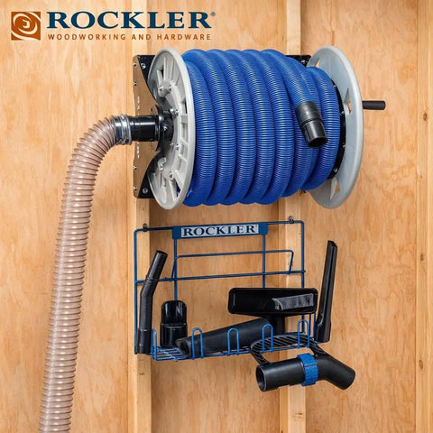 Shop Vacuum Hose Reel With 40 Ft Of 1.5 In Hose Wall Mount Steel Frame Adjustable Tension Knob Easy Install Dust Collector Accessory For Mess Free Cleanup In The Workshop mounted on wood wall with tools.