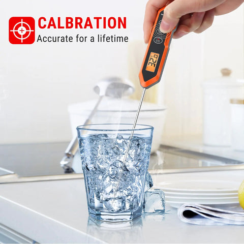 Hand using Waterproof Instant Read Meat Thermometer For Cooking With 5.4 Inch Stainless Steel Probe in a glass of water