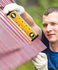 Man using Digital Level 10 Inch Torpedo Level With Protractor And Magnetic Base on roof for outdoor projects