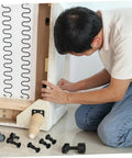 Person assembling furniture using Bulk 170 Piece Steel Furniture Hardware Kit Rock Solid Screws And Nuts For Bed Frame Cabinet Assembly.