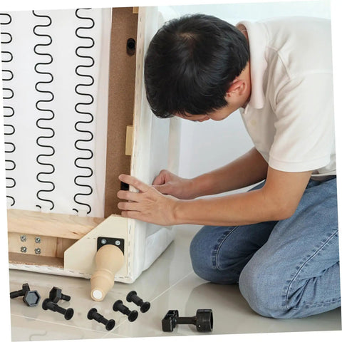 Person assembling furniture using Bulk 170 Piece Steel Furniture Hardware Kit Rock Solid Screws And Nuts For Bed Frame Cabinet Assembly.