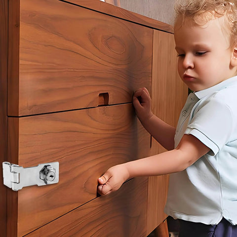 Child interacting with wooden cabinet secured by 3 Inch Keyed Door Lock Hasp Latch In Stainless Steel, heavy duty