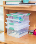 Six Pack Clip Boxes With Latching Lids, Stackable Clear Plastic Storage Bins For Arts And Crafts, Office, Classroom Or Home Organization, Large Fourteen By Eleven By Three And A Quarter Inches on a desk.