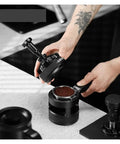 Pro Level 58mm Adjustable Espresso Puck Distribution Tool For Standard Portafilters being used to distribute coffee grounds.
