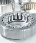 Close-up of cylindrical bearing with rollers in metallic silver tone, showcasing industrial bearing component design.