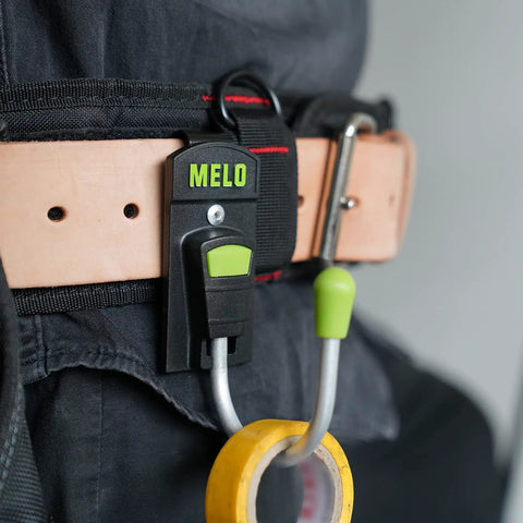 180 Degree Rotating Cordless Drill Holster Hook With Foldaway Design on leather tool belt, holding a yellow tool